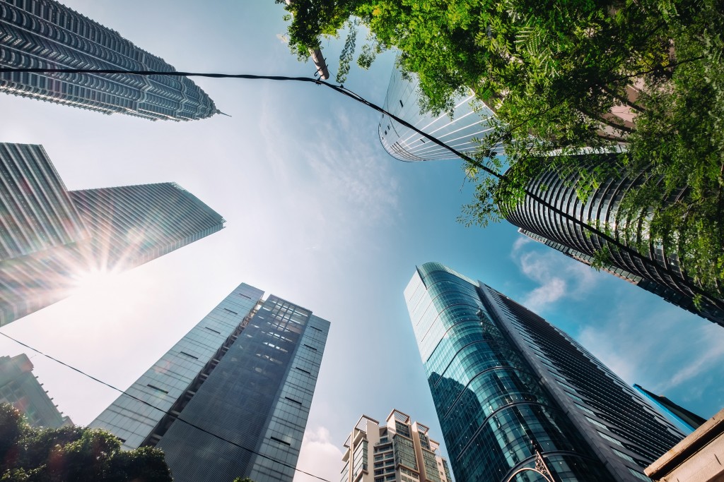 Looking up to the skyscraper's buildings. Modern business archit